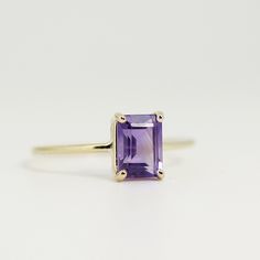 Emerald cut amethyst ring. This beautiful amethyst ring was made of 14k solid gold band and 8*6mm emerald cut amethyst stone in 14k gold prong setting DETAILS ABOUT THE RING, MATERIAL AND STONES Ring Band: 14K solid gold Ring Band size: 1.2 mm thick Gemstone: Natural Amethyst Amethyst size: 8mm x 6mm emerald cut Yellow gold or white gold options available from drop down menu. Thanks for visiting Melt'm Design Studio 14k Yellow Gold Emerald-cut Amethyst Ring, 14k Yellow Gold Emerald Cut Amethyst Ring, 14k Yellow Gold Amethyst Ring, Emerald Cut, 14k Gold Purple Emerald Cut Rings, Purple 14k Gold Ring With Emerald Cut, Purple 14k Gold Rings With Emerald Cut, Lavender 14k Gold Rings Fine Jewelry, 14k Gold Amethyst Ring With Lavender Gemstone, 14k Gold Lavender Amethyst Ring