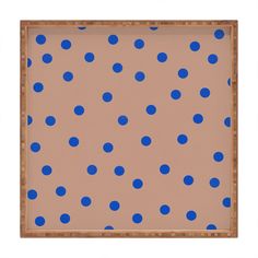 a painting with blue polka dots on it