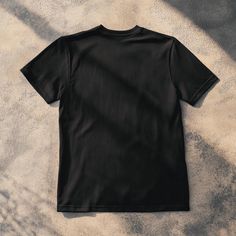 Basic Black Pre-shrunk T-shirt, Black Short Sleeve Branded T-shirt, Solid Color Graphic Print Crew Neck T-shirt, Solid Color Crew Neck T-shirt With Graphic Print, Solid Crew Neck T-shirt With Screen Print, Basic Tops With Sublimation Print For Streetwear, Black Casual Pre-shrunk T-shirt, Black Cotton T-shirt With Screen Print, Black Short Sleeve Top With Screen Print