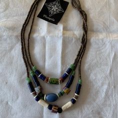 Handmade By Santa Fe Artist Terry Hawn. Beautiful Triple Strand Necklace Made From Antique African Trade Beads. The Beads In This One Are Gorgeous, Predominantly Greens And Blues. Traditional Handmade Double Strand Beaded Necklaces, Traditional Double Strand Beads For Gift, Traditional Handmade Double Strand Beaded Necklace, Double Strand Large Beads Necklace Gift, Traditional Double Strand Beaded Necklaces For Gifts, Double Strand Beaded Necklace With Large Beads As Gift, Gift Double Strand Beaded Necklace With Large Beads, Traditional Double Strand Beaded Necklace For Gift, Handmade Artisan Double Strand Beaded Necklace