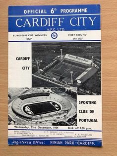 the official football program for cardiff city, which was printed in blue and white on a wooden table