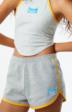 PacSun exclusive! Get ready to chill in style with the Fanta x PacSun Mini Sweat Shorts. These mid-rise shorts feature contrast binding and a curved hem for a sporty yet trendy look. Complete with Fanta embroidery and an elastic waistband, they offer a comfortable and effortless fit for casual days or lounging around.


	Solid color shorts
	Soft fleece lining
	10.75" rise
	2" inseam
	24.5" leg opening
	Mid-rise
	Elastic waistband
	Contrast binding
	Curved hen
	Fanta embroidery
	60% cotton, 40% polyester
	Machine washable
	Model is wearing a size small
	Model measurements: 5’6” height, 30” bust, 25.5” waist, 36.5” hip Storm Reid, Sweatpants Shorts, Mid Rise Shorts, John Galt, Sweat Shorts, Indie Brands, Color Shorts, Pant Shirt, Short Rompers