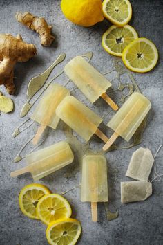 popsicles with lemons and ginger are on a table