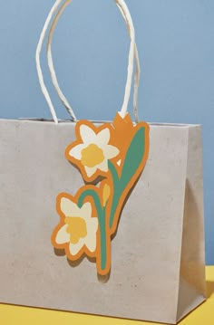 a brown paper bag with flowers on it