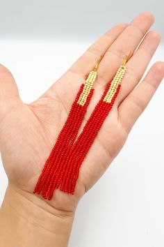 Minimalist red beaded earrings. Earrings made of high quality Preciosa Czech beads (red natural and shiny red) and Japanese TOHO beads (gold). Made using strong bead weaving thread. 100% handmade. --------------- Size: ● Length 4.7'' (12 cm) including earring hook ● Width 0.5'' (1.2 cm) --------------- SHIPPING I use Express shipping to USA only 5-10 working days + processing time (1-3 working days) --------------- Gift packedge - FREE! Red Beaded Fringe Drop Earrings, Red Tassel Earrings With Dangling Round Beads, Red Tassel Earrings With Round Beads As Gift, Red Round Beads Jewelry With Tassels, Red Tassel Jewelry With Round Beads, Red Jewelry With Tassels And Round Beads, Red Drop Earrings With Tiny Beads, Elegant Red Earrings With Tiny Beads, Red Beaded Fringe Tassel Earrings With Round Beads