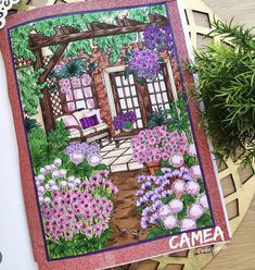 an image of a garden scene with flowers and plants on the table next to it