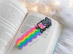 an open book with a pixel on it