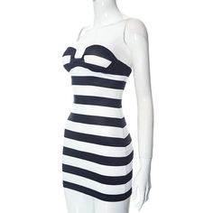 This dress features a strapless design and chest wrap detailing, creating a flattering and modern silhouette. The striped pattern adds a touch of sophistication to the look. - Color: Black- Style: Bodycon- Pattern Type: Stripe- Sleeve Length: Strapless- Length: Mini - Fabric: Polyester- Fit Type: Slim Fit- Occasion: Casual, Party- Gender: Women- Size: S, M, L Black Vertical Stripes Summer Dress, Fitted Striped Dress With Spaghetti Straps, Striped Fitted Dress With Spaghetti Straps, Striped Bodycon Dress For Summer, Chic Summer Bandage Dress With Sweetheart Neckline, Striped Fitted Mini Dress With Spaghetti Straps, Striped Bodycon Beach Dress, Striped Mini Dress With Spaghetti Straps, Striped Bodycon Dress For The Beach