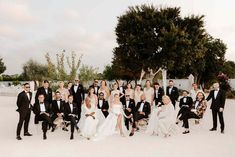 a large group of people dressed in formal wear