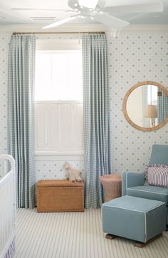 a baby's room with blue and white decor