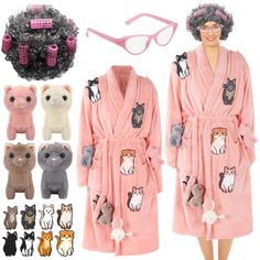 a woman wearing a pink robe with cats on it