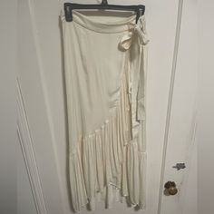 I Purchased This Silky Midi Skirt On A Recent Trip To Paris Only To Come Home And Realize It’s A Bit Small. Brand New Condition. Size 38 In France But A Size 6 Us. Has The Appearance Of A Wrap Skirt But Is Actually Closed Via A Zipper. Lined. White Chic Flowy Wrap Skirt, Cream Asymmetrical Summer Skirt, Cream Asymmetrical Relaxed Skirt, Chic White Tiered Wrap Skirt, White Tiered Maxi Skirt For Brunch, White Tiered Skirt For Brunch, White Flared Wrap Skirt For Summer, White Asymmetrical Wrap Skirt For Spring, Cream Flowy Skirt For Brunch