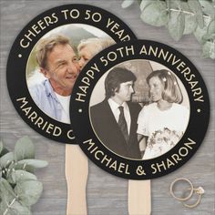 a couple's wedding photo and two wooden spoons with the words, cheers to 50 year anniversary married c michael & sharon