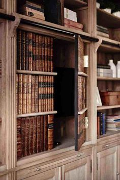 an old bookcase with many books on it and the words interior designers & decorators