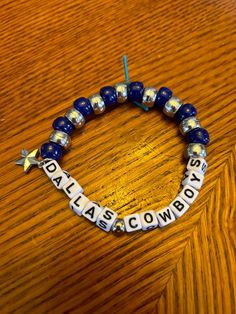 Stretchy, comfortable Dallas Cowboys beaded friendship bracelet with charm for games, birthdays or other events. Made with stretch cord and pony beads by me with the hopes of sharing more friendship bracelets with sports fans out there! Cowboy Bracelet, Dallas Cowboys Clay Bracelets, Cowboys Bracelet, Dallas Cowboy Bracelet, Adjustable Bracelets For Game Day, Football Season, Paracord Keychain, Pony Bead Crafts, Friendship Bracelets With Beads, Friendship Bracelet