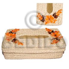 a white basket with orange flowers on it and a matching handbag in the background