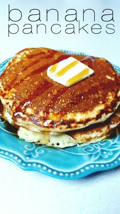 pancakes with butter and syrup on a blue plate