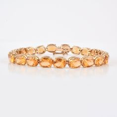 This is a classic style tennis bracelet. A must-have statement piece for every woman. It's a classic luxury to have. -Material - 14K Solid Yellow Gold -Gemstone - Genuine Citrine -Gemstone Weight - 25.740 ct -Gross weight - 15.20 grams It can help strengthen self-esteem and a positive, vibrant flow of energy in and around one's body. Citrine is also considered helpful in improving digestion and strengthening one's physical endurance. Throughout history and in many cultures citrine was known as t Improving Digestion, Citrine Bracelet, Gold Link Bracelet, Bracelet Minimalist, Gold Armband, Birthstone Bracelet, Gold Link, Emerald Pendant, Birthstone Bracelets