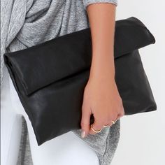 Nwt Black Clutch. Soft And Lightly Crackled Vegan Leather Form A Chic Rectangular Clutch That Rolls Up And Secures With Hidden Magnetic Closures. Unroll To Find A Front Flap Pocket, And Main Compartment (With Hidden Magnet Closures) With Additional Zip Pocket. Carry As A Clutch, Or Attach The Shoulder Strap Measuring 53" At Longest Adjustment. * Lined. * 100% Polyurethane. Cheap Square Clutch For Daily Use, Cheap Single Compartment Clutch For Women, Cheap Modern Clutch With Multiple Compartments, Cheap Black Clutch With Card Slots, Cheap Rectangular Clutch With Removable Pouch, Cheap Rectangular Clutch With Card Slots, Cheap Black Clutch With Interior Card Slots, Luxury Black Clutch, Cheap Envelope Clutch For Travel