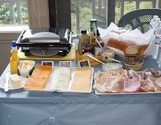 the table is covered with food and condiments