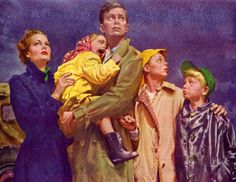 a man holding a child while standing next to two other men and a woman in raincoats