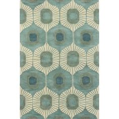 a rug with an abstract design on the front and back of it, in light green