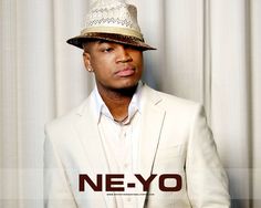 a man in a white suit and hat posing for a photo with the words ne - yo on it