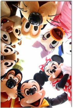 many mickey mouses are standing in a circle