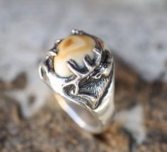 Introducing our new line of Elk Tooth (elk ivory) "Lost Wax Casting" rings! This design features the carving of an elk but could feature anything you request! Additional wood and inlay options available upon request. Each ring is hand-carved by our in-house artist Kevin Fredrickson, and set using an ethically collected elk tooth. Available in: SILVER & 10K GOLD We love taking on custom orders. If you have your own idea for a design reach out to us in the contact section of the website, we want t Wax Casting Rings, Lost Wax Casting Rings, Elk Ivory Ring, Elk Ivory Jewelry, Antler Wedding Rings, Antler Wedding Band, Elk Ivory, Tooth Ring, Ivory Ring