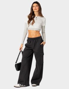 Reach Your Ultimate Level Of Coziness, While Still Feeling On-Trend With These Perfect Oversized Sweatpants. Sweatpants. Wide Leg. Cargo Style Pockets. 100% Cotton. Model Wears Size S. Model Height Is 5'7. Item Care: Machine Wash At Maximum Of 30ºc, Do Not Bleach, Tumble Dry Low, Iron At A Maximum Of 110ºc, Do Not Dry Clean. | Edikted Wide Leg Cargo Sweatpants High-waist Sweatpants With Side Pockets For Fall, Baggy Sporty Bottoms For Fall, Fall Baggy Wide Leg Joggers, Sporty Wide Leg Pants With Pockets For Fall, Sporty Baggy Bottoms For Fall, Full-length Cargo Pants For Fall Loungewear, Full Length Cargo Pants For Loungewear In Fall, Baggy Pants With Ribbed Waistband For Fall, Fall Athleisure Wide Leg Pants With Pockets