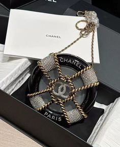 This beautiful Chanel bag is the perfect addition to any fashion-forward woman's wardrobe. The exterior of the bag is made of high-quality resin and comes in a classic black color that will complement any outfit. The bag features a crossbody style that is both practical and fashionable. Comes with dust bag and the box. Very rare and unique bag. 💝 Follow my store on IG luxuryboutiqueinc I sell only authentic items ,please check my page on IG for more items. No returns or exchanges, sales are final. Unique Chanel Bag, Rare Chanel Bag, Chanel Price, Crystal Bags, Unique Purses, Unique Bags, Women's Wardrobe, Very Rare, Chanel Bag