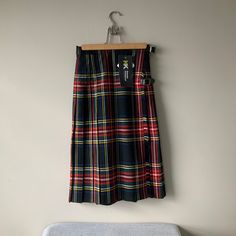 Deadstock with tags, girls traditional tartan kilt by Stoodley Knowle. Waist 24 inches L 24 inches, 59cm. Polyester and viscose mix with Teflon fabric protector, KK Bespoke schoolwear. Lovely kilt with apron front, stitched down pleats, leather straps with buckles. Excellent unworn vintage condition. For more vintage clothes and accessories visit my shop https://www.etsy.com/uk/shop/coolclobber Scottish Style Fitted Skirt For School, Scottish Fitted Skirt For School, Fitted Scottish Skirt For School, Fitted Scottish Pleated Skirt, Fabric Protector, Kilt Skirt, Tartan Kilt, Scottish Tartans, Vintage Clothes