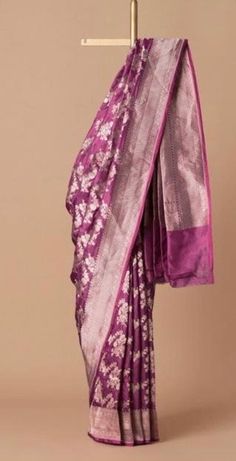 Banarasi uppada fits any and every occasion around the corner, be it formal or informal gatherings. This Silk saree has adorning motifs that are gracefully connected. Katan Uppada is light and soft in texture, associating regal efficacy. PRODUCT DESCRIPTION Fabric -  Katan Silk Technique - Cutwork Color - violet  Maintenance - Dry Wash Only NOTE This is a hand-woven saree so there might be some irregularities, but that is what makes a banarasi saree unique. The color of the product you see on your screen may slightly vary due to difference in device's color settings. Purple Paithani Silk Pre-draped Saree For Wedding, Purple Katan Silk Pre-draped Saree With Cutdana, Elegant Handloom Purple Pre-draped Saree, Elegant Purple Handloom Pre-draped Saree, Purple Katan Silk Saree With Self Design, Purple Art Silk Pre-draped Saree For Puja, Purple Katan Silk Pre-draped Saree, Purple Pre-draped Saree With Pallu In Katan Silk, Purple Katan Silk Pre-draped Saree For Puja