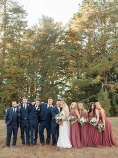 a bride and groom with their bridal party