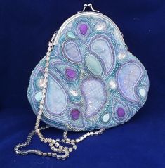 "SALE PRICE( WAS £65 IN uk) A beautiful beaded and machine embroidered purse suitable for evening, wedding, or any other special occasion. The shoulder length strap is diamante.  The turquoise lining is cotton with an internal pocket. The beading is added to a semi-precious oval stone and shell beads. The  pattern is based on the ever-popular paisley motif which is repeated on the machine embroidered back. The dimensions are 7\" x 7\". This would make a lovely gift for someone special.  All the Embroidery Jewellery, Tiny Purses, Beaded Objects, Tiny Purse, Shoes Inspiration, Embroidered Handbag, Handcrafted Bags, Beaded Bag, Bead Embroidery Jewelry