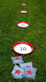 some red white and blue frisbees sitting in the grass