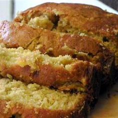 sliced loaf of banana bread sitting on top of a cutting board