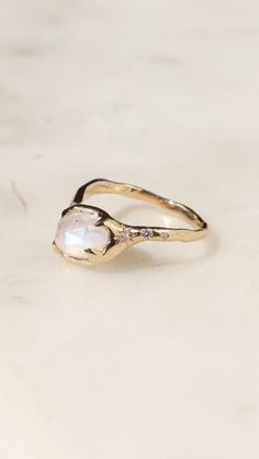 A rose cut moonstone is prong set in 14k yellow gold with star set diamonds along the band. This ring is made to order and can be made in any gold color and ring size. #moonstonering #moonstone #goldring #diamondengagementrings #engagementring #uniquerings Alternative Engagement Rings, Engagement Ring Styles, Moonstone Ring, The Band, Unique Engagement Rings, A Rose, Rainbow Moonstone, Unique Rings, Rose Cut