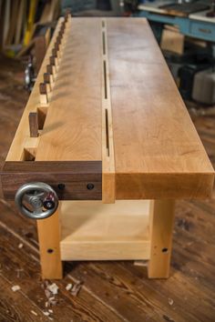 a workbench made out of plywood and wood with metal pulls on it