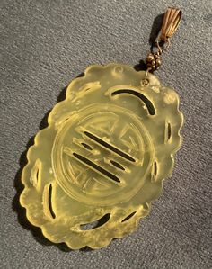 Excited to share this item from my #etsy shop: Hand Carved ~ Vintage ~ Jade ~ Pendant ~ Jade Necklace Vintage Oval Jade Necklace, Round Yellow Jade Jewelry, Yellow Jade Round Jewelry, Yellow Round Jade Jewelry, Vintage Jade Round Pendant Jewelry, Antique Engraved Jade Jewelry, Vintage Carved Necklace With Round Pendant, Vintage Jade Gemstone Jewelry, Antique Jade Pendant Necklace