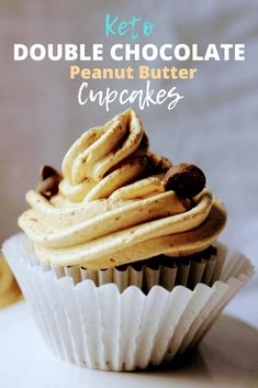 a close up of a cupcake on a plate with the words keto double chocolate peanut butter cupcakes