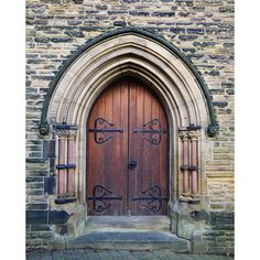 an old church door with iron work on it