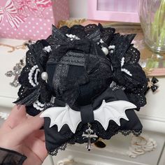 This price is for a mini hat only, others are not included.  Bowknot detail, cross charm, lace trim, beaded halloween mini hat. Beaded Halloween, Mini Hat, Wing Design, Halloween Beads, Bat Wing, Wings Design, Cross Charms, Bat Wings, Larp