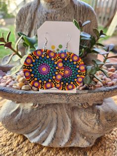 These unique wooden mandala earrings are a stunning piece of wearable art that will make a great addition to your accessory collection! Dress them up or wear them casually either way they are sure to suit every occasion. The wooden discs are hand painted dot by dot and sealed for shine and protection and they are light weight which makes them very comfortable to wear! The hand painted discs come on a surgical steel shepherd hook style earrings The total drop of earring is approx 7cm with each disc measuring 5cm. If you love this design but would like it in a different colour please feel free to message me and I will be more than happy to chat with you about creating something for you. Note: *This is a loving handmade piece and is classed as costume jewellery, It should be handled with care Painted Discs, Dot By Dot, Mandala Earrings, Main Point, Shepherds Hook, Hand Painted Earrings, Painted Earrings, Mandala Stones, Make Color