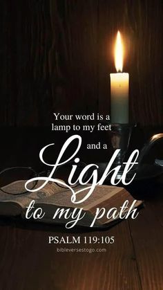 a lit candle with the words light to my path