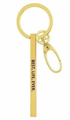 a gold keychain with the words best life ever on it and a pair of scissors