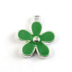 Green and silver colour flower charms that are silver alloy with Green enamel. They are the perfect focal point for your projects. You can use these on a chain, multiple strands of beading wire, leather cord, and more. Perfect for wine charms, bracelet, necklace, keychain, zipper pulls and other crafting projects. Made out of Alloy (Lead and Nickel free) and Enamel Silver / Green Colour Dimensions about 17x15 mm Quantity 10 pieces We sell crafting supplies in larger bulk quantities. If you want Necklace Keychain, Green And Silver, Charms Bracelet, Dragon Pendant, Silver Colour, Beading Wire, Green Flower, Wine Charms, Enamel Flower