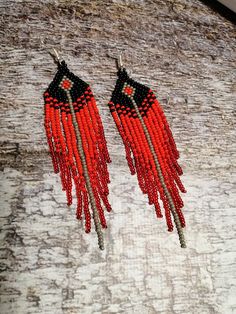 Traditional Red Fringe Jewelry, Traditional Red Jewelry With Fringe, Red Beaded Fringe Dangle Earrings, Red Beaded Fringe Drop Earrings, Red Beaded Tassel Drop Earrings, Red Beaded Earrings With Tassels, Red Beaded Dangle Earrings With Tassels, Traditional Red Beaded Tassel Earrings, Red Beaded Earrings With Tassels And Round Beads