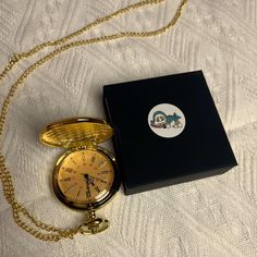 This gold vintage pocket watch is a unique accessory for both men and women. Featuring a classic Roman numeral scale and a beautiful box, it is perfect for special occasions or everyday wear. The cover of the pocket watch is printed with a cute cartoon image on the inside, adding a personalized element. With a chain, this pocket watch can be easily hung in a pocket or used as a necklace pendant. Whether it is for personal use or as a gift, it is a good choice. Buy now to make time more elegant and unique. Gold Pocket Watch Collectible, Yellow Gold Self-winding Pocket Watch As Gift, Vintage Gold Compact Pocket Watch, Cartoon Image, Elegant Self-winding Collectible Pocket Watch, Collectible Yellow Gold Self-winding Pocket Watch, Women Fashion Accessories, Vintage Pocket Watch, Cute Cartoon Images