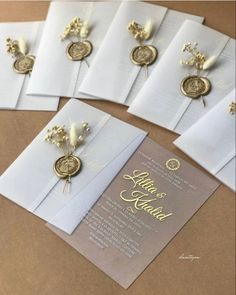 the wedding stationery is laid out and ready to be put into their guests'envelopes